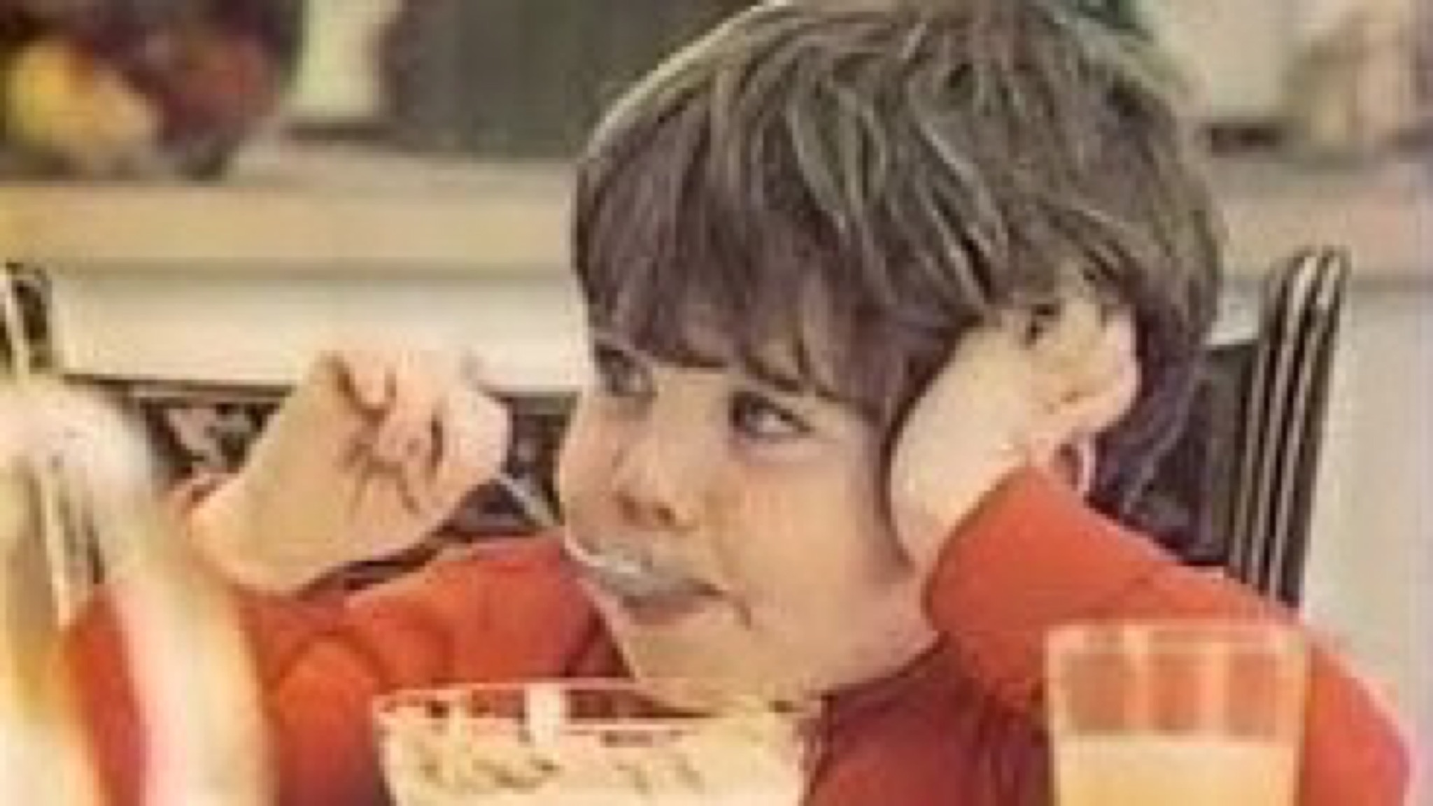 Still of young Mikey from the 1972 Life cereal commercial, spoon in hand, mid-bite