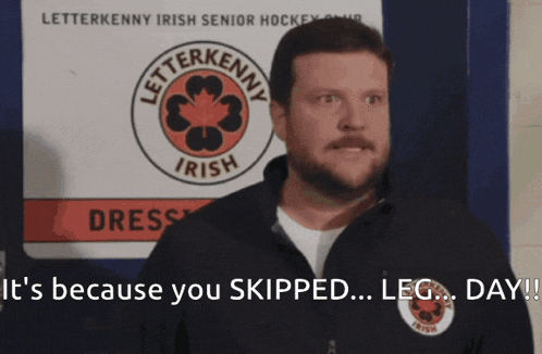 GIF of Coach McMurray from Letterkenny in a hockey locker room, yelling with wide eyes: “It’s because you SKIPPED… LEG… DAY!!”